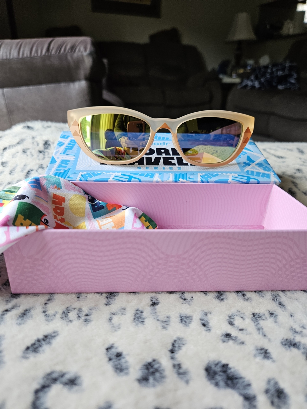Goodr Cat-Eye World Traveler Sunglasses with Gold Mirrored Lenses.